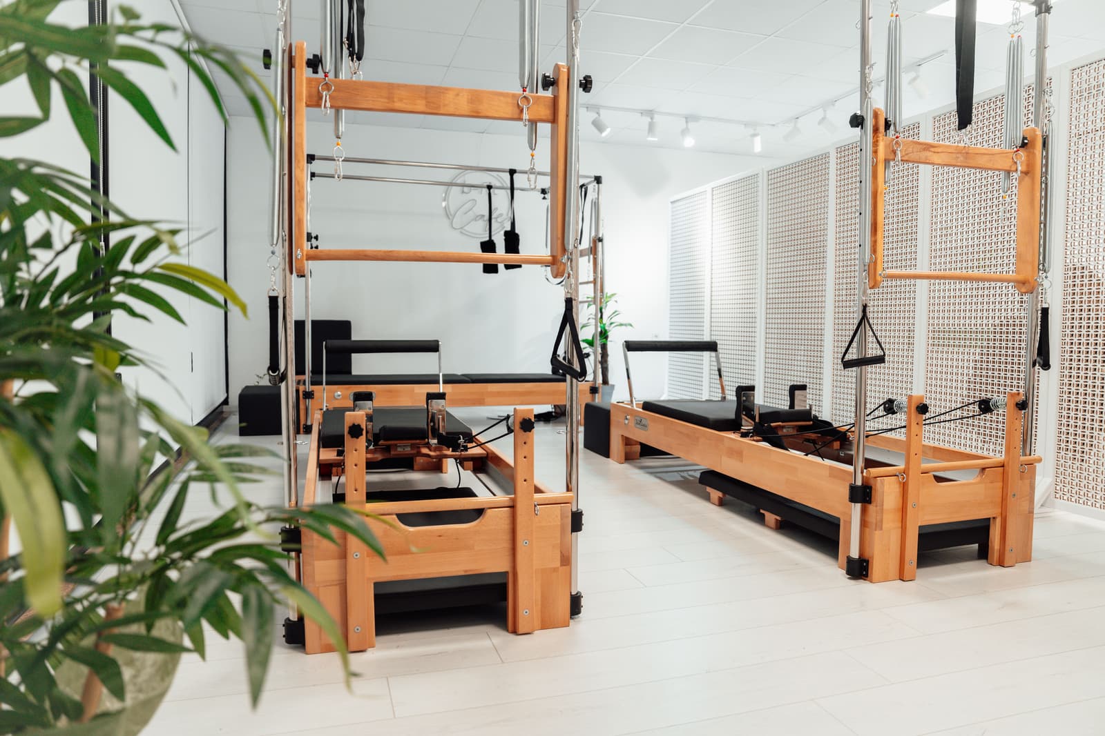 The studio floor at Ashbourne Mews, with its timber frames and reformers.